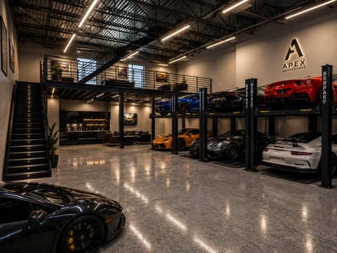 Luxury auto loft interior with mezzanine office